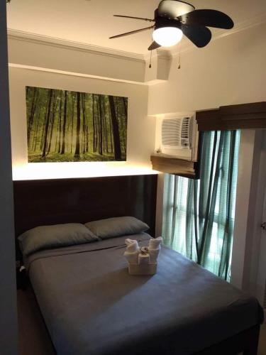 Postel nebo postele na pokoji v ubytování Tagaytay Prime Residence - STUDIO