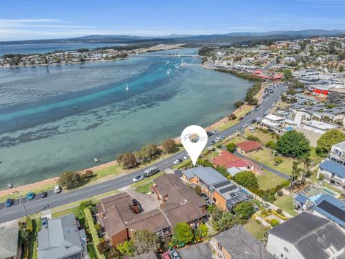 an aerial view of a city and a river at 15 Beach St in Merimbula