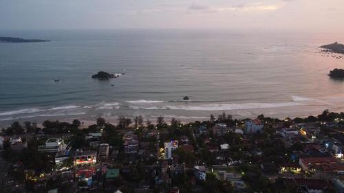 an aerial view of a beach and the ocean at Mzion Hotel Weligama in Weligama