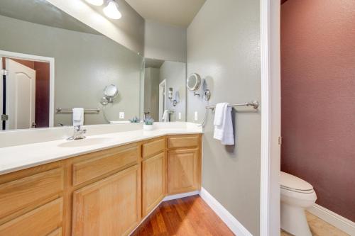 a bathroom with a sink and a toilet at Ski Getaway with Hot Tub Reno Home by Attractions in Reno