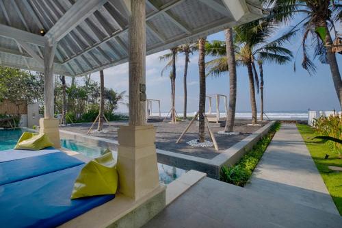 a view of the beach from the pool of a villa at Saba Villa by Sanga Sanga Hospitality in Saba