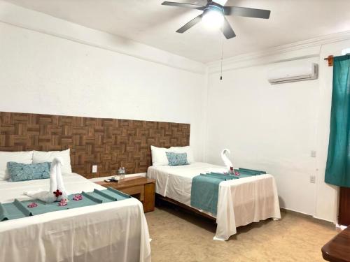 Postel nebo postele na pokoji v ubytování Hotel Acapulco Club Diamante