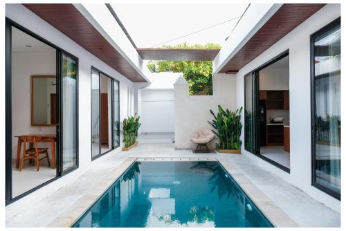 an external view of a house with a swimming pool at Gamara Villa-2BR With Pool in Ketewel