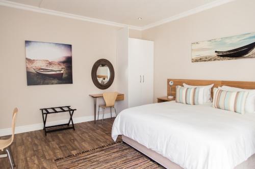 Postel nebo postele na pokoji v ubytování Devereux Lodge