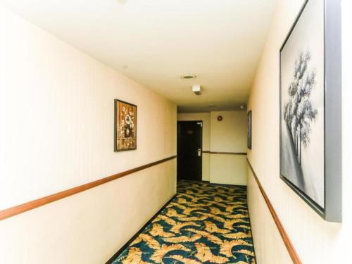 a hallway with a rug on the floor of a room at Bay Hotel in Lahad Datu