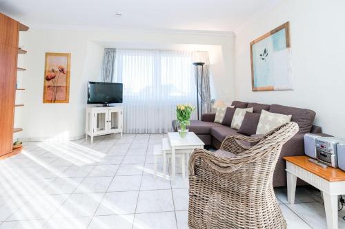 TV a/nebo společenská místnost v ubytování Haus-Ornum-3-OG-Wohnung-25