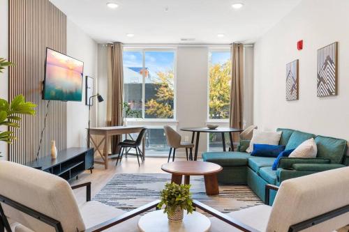a living room with a couch and a table at Modern 1-BD - Pier Views - Near Old City in Philadelphia