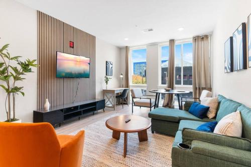 a living room with a couch and a table at 1BD - Sleeps 4 - Harbor Views - Near Fish Town- in Philadelphia
