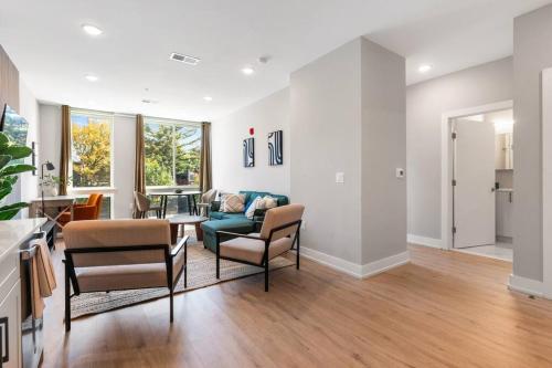 a living room with a couch and chairs at 1BD - Sleeps 4 - Harbor Views - Near Fish Town- in Philadelphia