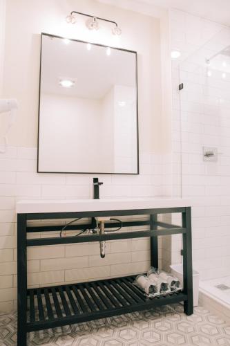 a bathroom with a sink and a mirror at The St. Clair in Frankfort