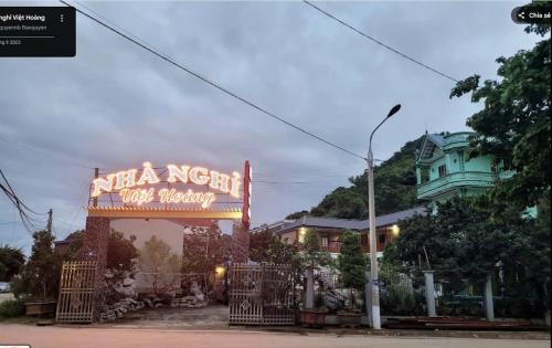 a sign for a nilla north guest house at Việt Hoàng MC - by BAY LUXURY in Làng Môn