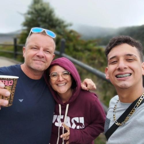 two men and a woman posing for a picture at Cata Bed Breakfast Pet-friendly in San José
