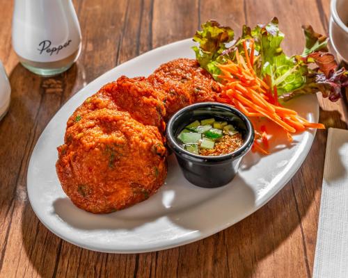 a plate of food with a fried chicken and a salad at The Select Inn Gosford in Gosford