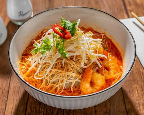 a bowl of noodles with shrimp and cheese at The Select Inn Gosford in Gosford