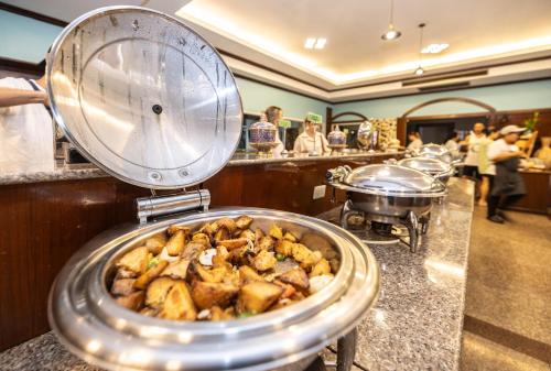 a tray of food on a counter in a restaurant at Baumanburi Hotel Patong in Patong Beach