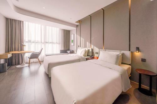 Katil atau katil-katil dalam bilik di Atour Hotel Luzhou Bubugao New World