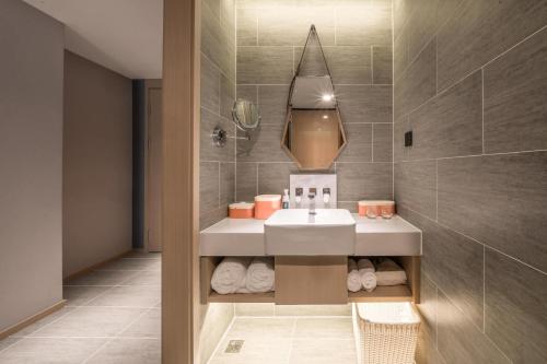 Bilik mandi di Atour Hotel Luzhou Bubugao New World