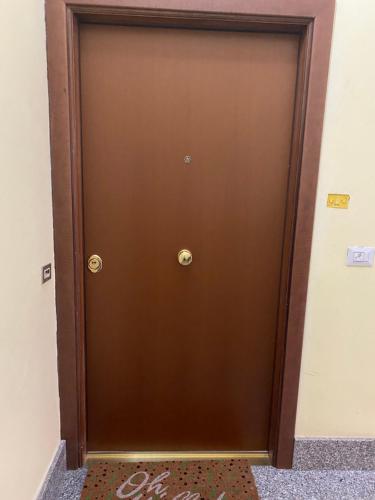 a brown door in a room at New Comfortable Apartment in Rome