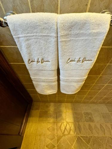 two towels hanging on a rack in a bathroom at Casale La Quercia in Poggio Bustone