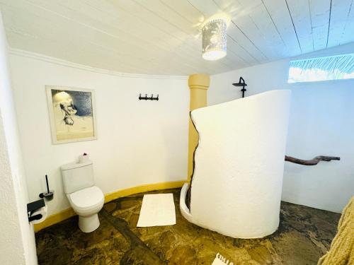 a bathroom with a toilet in a room at Dream Luxury B&b Watamu in Watamu