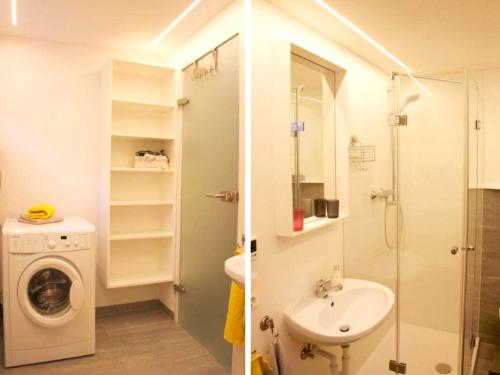 a bathroom with a sink and a washing machine at Apartment in Fulpmes near Stubai Glacier in Fulpmes