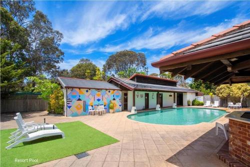 a house with a swimming pool in a yard at Marguerite Studio - central town & pool in Margaret River Town