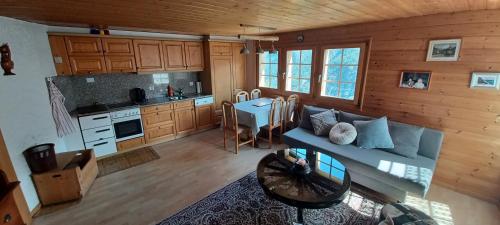 an overhead view of a living room and kitchen in a cabin at Chalet 3 pièces de caractère in Mayoux