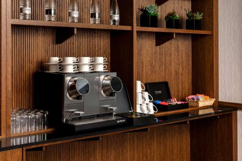 a microwave sitting on a counter in a room at Hilton Birmingham Metropole Hotel in Bickenhill