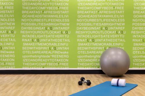 a yoga mat and a ball in front of a wall at La Quinta by Wyndham Newark - Elkton in Elkton