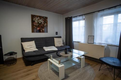 a living room with a couch and a table at JS-Eyach in Balingen