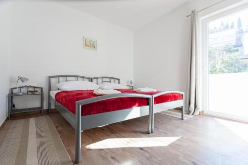 Apartment Rubidus A50 tesisinde bir odada yatak veya yataklar