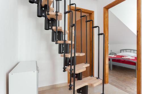 a room with a staircase with a mirror at Apartment Igneus A51 in Dubrovnik
