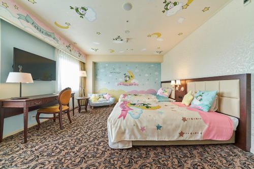 a bedroom with a bed and a desk and a computer at Saitama Grand Hotel Fukaya in Fukaya