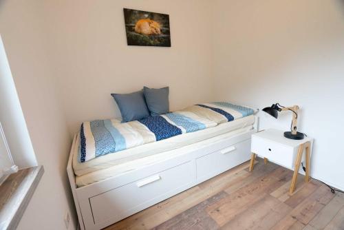 Postel nebo postele na pokoji v ubytování Ferienhaus Harzblüte