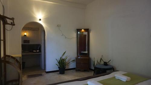 Ένα ή περισσότερα κρεβάτια σε δωμάτιο στο Tree House Villa