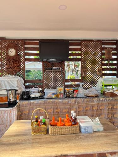 a kitchen with a counter with baskets on it at Rang Noknoy Resort at Kohlarn in Ko Larn