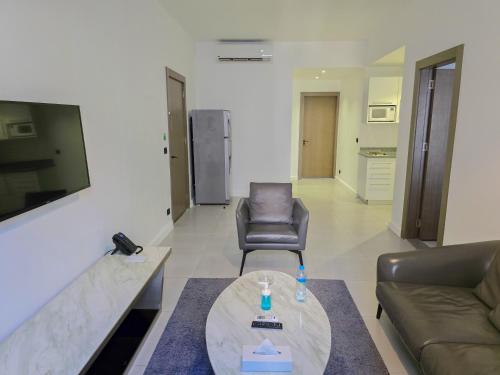 a living room with a couch and a table at Palma Hotel in Port Said