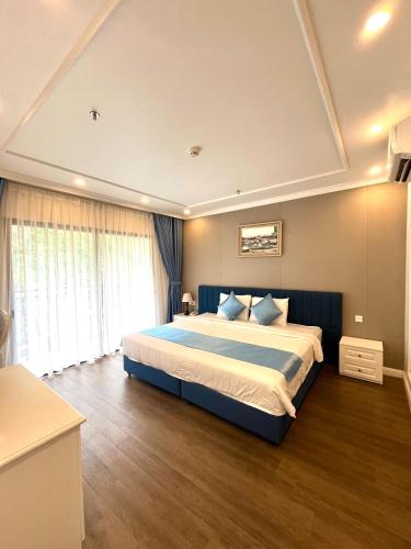 a bedroom with a large bed in a room at Cannon Fort - The Viewpoint Hotel in Cat Ba