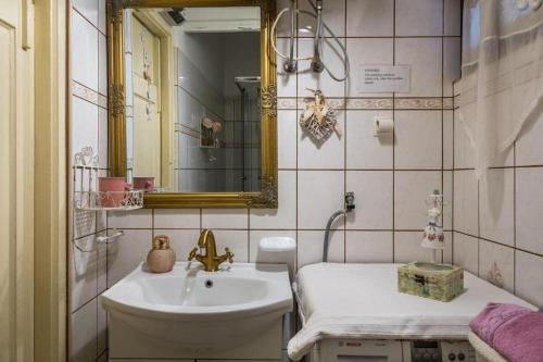 a bathroom with a sink and a mirror at House Ingrid in Rijeka