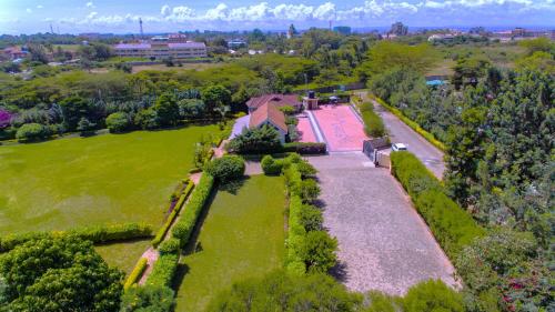 an aerial view of a house in a field at Sportsview Hotel Kasarani in Nairobi