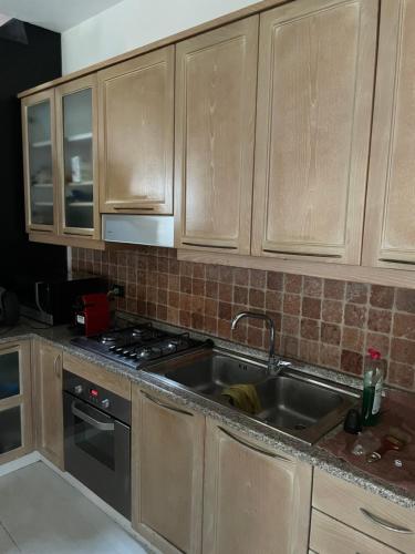 a kitchen with a sink and a stove at Rooftop open space in Stra
