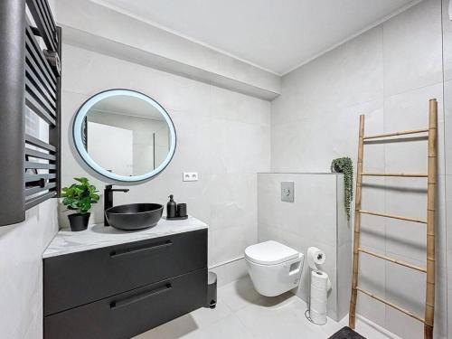 Et badeværelse på Escapade confortable et chic parking et vélo-box