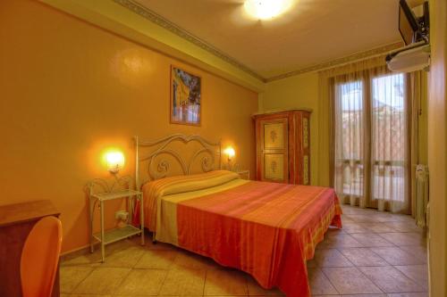 a bedroom with a large bed in a room at B&B Epos Acitrezza in Acitrezza