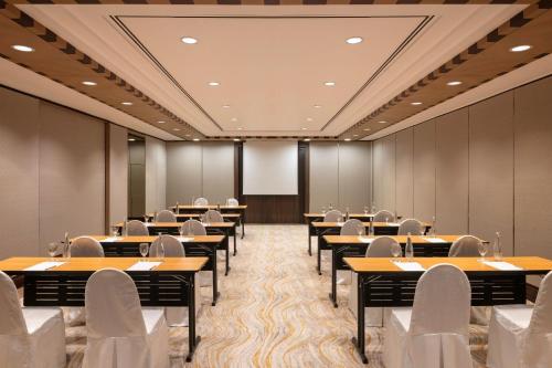 a conference room with tables and chairs in it at Dusit Princess Melaka in Melaka