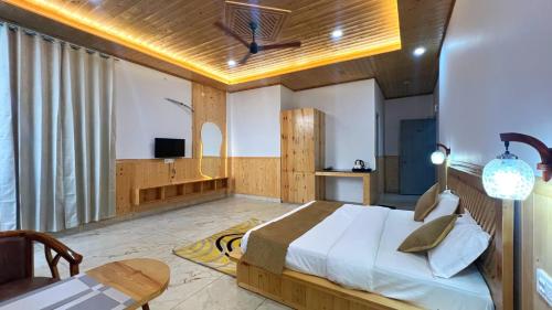 a bedroom with a bed and a basketball hoop on the ceiling at New Heights Kasauli by Humble Stya in Kasauli