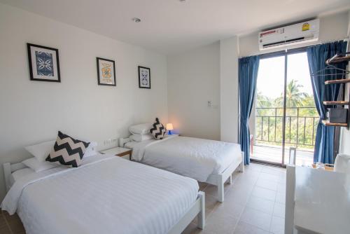Cama o camas de una habitación en Maikhao Hotel, Phuket