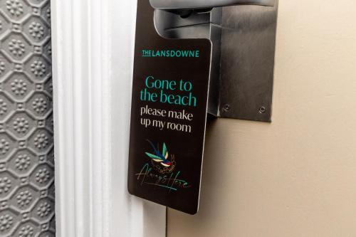 a door handle with a sign on the door at The Lansdowne, Eastbourne in Eastbourne