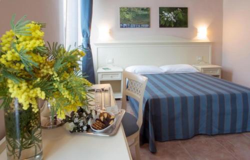 Postel nebo postele na pokoji v ubytování Hotel le Muse
