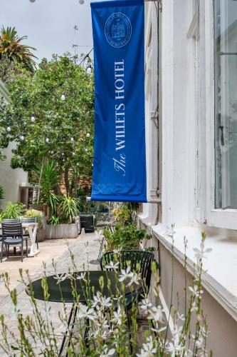 a blue flag hanging on the side of a building at The Willets Boutique Hotel in Simon's Town in Simonʼs Town