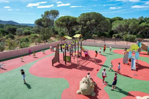a group of children playing at a playground at Camping les Cigales in Le Muy
